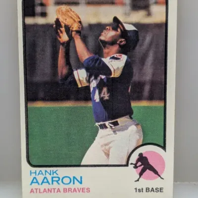 Sale Photo Thumbnail #551: Vintage 1974 Topps Hank Aaron baseball card #100, featuring the Atlanta Braves legend in field position.