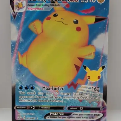 Sale Photo Thumbnail #666: Surfing Pikachu VMAX Pokémon trading card from the 2021 Celebrations set, featuring full-art holographic artwork.