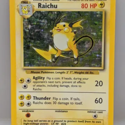 Sale Photo Thumbnail #128: Vintage 1999 Pokémon Base Set holographic Raichu card (14/102), illustrated by Ken Sugimori.
