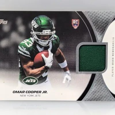 Sale Photo Thumbnail #400: Topps Omar Cooper Jr. New York Jets rookie trading card featuring a player-worn green jersey memorabilia swatch.