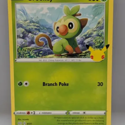 Sale Photo Thumbnail #704: Pokémon Grookey trading card (8/25) from the 25th Anniversary Celebrations McDonald's collection, dated 2021.