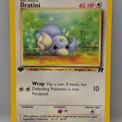 Sale Photo Thumbnail #414: 1st Edition Dratini Pokémon trading card from the Team Rocket set, numbered 53/82, illustrated by Kagemaru Himeno.