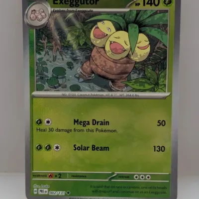 Sale Photo Thumbnail #535: Pokémon Exeggutor trading card, set 002/131, in near-mint condition.