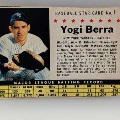 Sale Photo Thumbnail #272: 1961 Post Cereal Yogi Berra Baseball Star Card No. 1, featuring career batting statistics and a player biography.