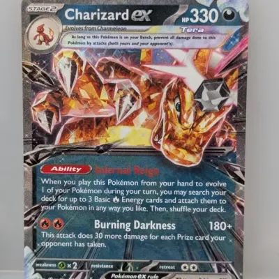 Sale Photo Thumbnail #505: Pokémon Trading Card Game Charizard ex Tera promo card (SVP EN 196) featuring a textured full-art holographic foil finish.