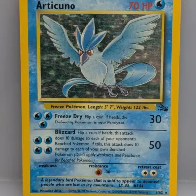 Sale Photo Thumbnail #17: 1999 Pokémon Fossil set holographic Articuno trading card (2/62), illustrated by Mitsuhiro Arita, displaying minor surface scratching on the foil.