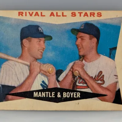 Sale Photo Thumbnail #135: Vintage 1958 Topps #418 "Rival All Stars" Mickey Mantle and Ken Boyer baseball card. Shows minor corner wear and slight creasing typical of its age.