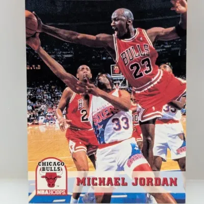 Sale Photo Thumbnail #507: 1990-91 NBA Hoops Michael Jordan #65 basketball trading card in good condition.