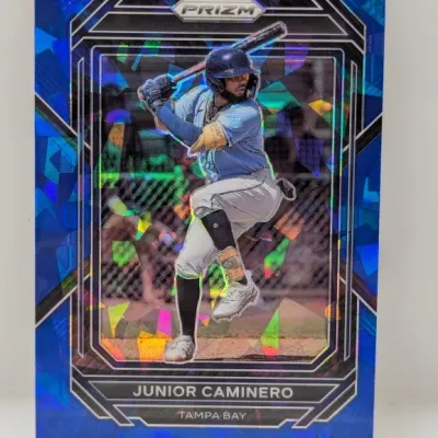 Sale Photo Thumbnail #495: Panini Prizm Junior Caminero Tampa Bay baseball card featuring a blue geometric cracked-ice parallel design.