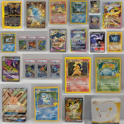Sale Photo Thumbnail #2: Collection of Pokémon trading cards including vintage Base Set, modern ultra rares, PSA-graded promo cards, and a 25th Anniversary Celebrations Elite Trainer Box.
