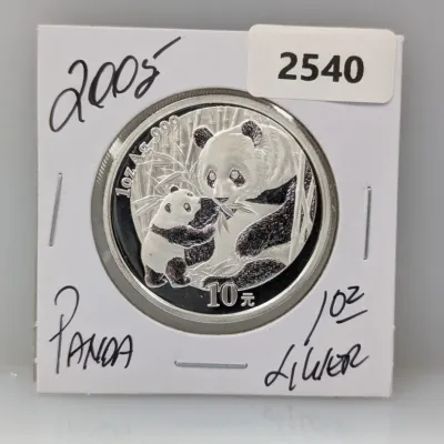 Sale Photo Thumbnail #865: 2005 Chinese Silver Panda 10 Yuan 1 oz .999 fine silver coin, housed in a protective card holder.