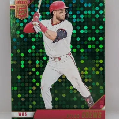 Sale Photo Thumbnail #735: Panini Elite Extra Edition Dylan Crews baseball card featuring a green foil disco parallel background design.