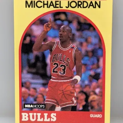 Sale Photo Thumbnail #490: 1989-90 NBA Hoops #200 Michael Jordan basketball card featuring a yellow border design.