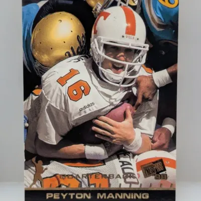 Sale Photo Thumbnail #537: 1998 Press Pass Peyton Manning rookie trading card, featuring him in his Tennessee Volunteers uniform.