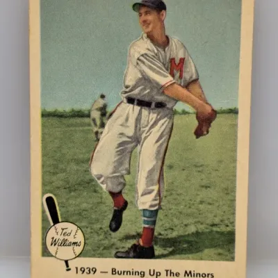 Sale Photo Thumbnail #127: Vintage Ted Williams baseball card, titled "1939 - Burning Up The Minors", showing light corner wear and slight yellowing along the borders.