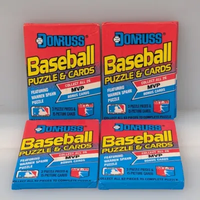 Sale Photo Thumbnail #376: Four unopened wax packs of 1988 Donruss Baseball puzzle and card packs featuring the Warren Spahn puzzle.
