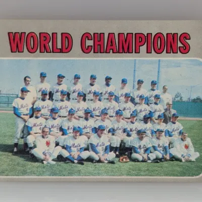 Sale Photo Thumbnail #325: 1970 Topps #1 World Champions New York Mets team baseball card, featuring a group photo on a gray border.