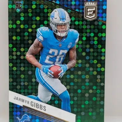Sale Photo Thumbnail #246: 2023 Panini Donruss Elite Jahmyr Gibbs rookie football card featuring a green and blue disco mosaic foil parallel.