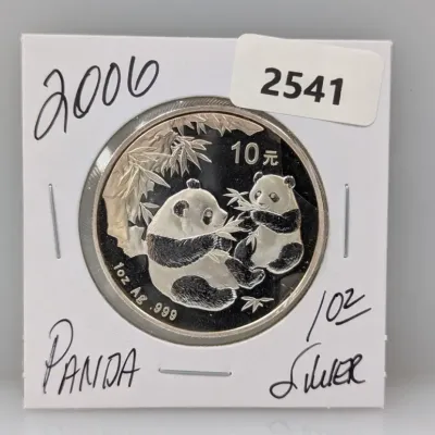 Sale Photo Thumbnail #866: 2006 Chinese Silver Panda 10 Yuan coin, 1 oz .999 fine silver, housed in a protective cardboard flip.