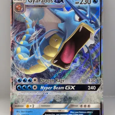 Sale Photo Thumbnail #560: Gyarados GX promo trading card (SM212) from the 2019 Pokémon Sun & Moon promo series, featuring full-art holographic foil finish.