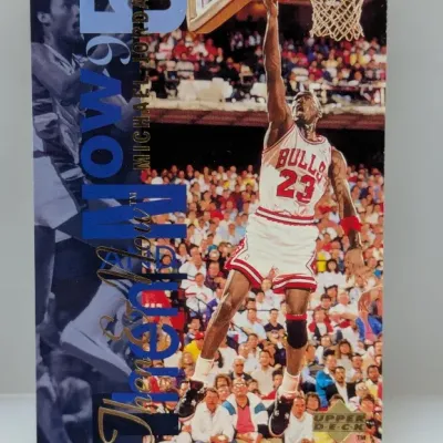 Sale Photo Thumbnail #682: 1995 Upper Deck 'Then & Now' Michael Jordan basketball trading card #N5 featuring the Chicago Bulls star dunking.