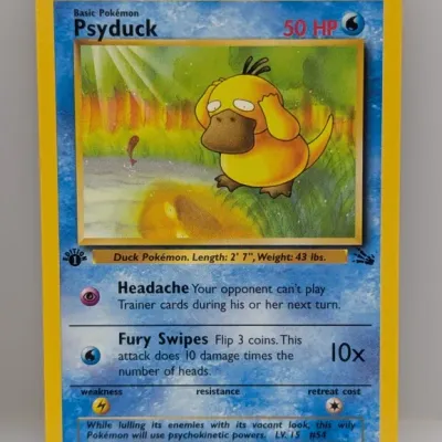Sale Photo Thumbnail #322: 1st Edition Psyduck Pokémon card (#53/62) from the 1999 Fossil set, illustrated by Kagemaru Himeno.