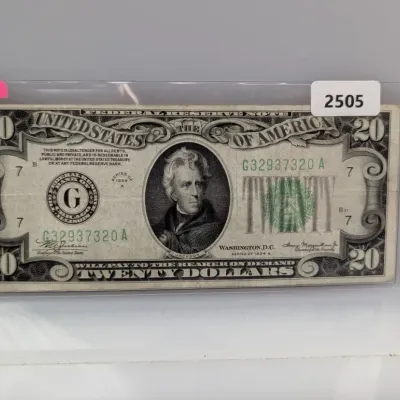 Sale Photo Thumbnail #830: Series 1934-A $20 Federal Reserve Note from the Federal Reserve Bank of Chicago, encased in a protective plastic sleeve.