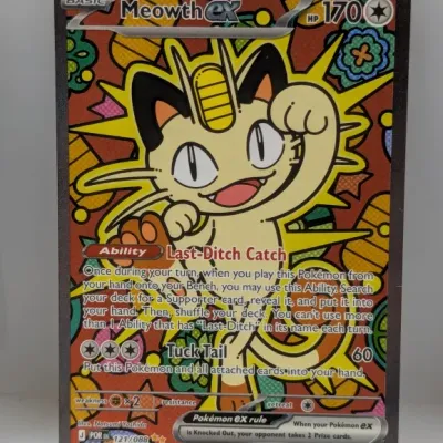 Sale Photo Thumbnail #75: Meowth ex full-art Pokémon trading card, numbered 121/088, illustrated by Natsumi Yoshida, in near-mint condition.