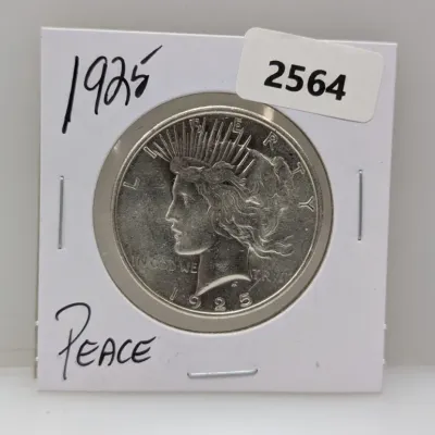 Sale Photo Thumbnail #889: 1925 Peace silver dollar coin mounted in a cardboard flip holder.