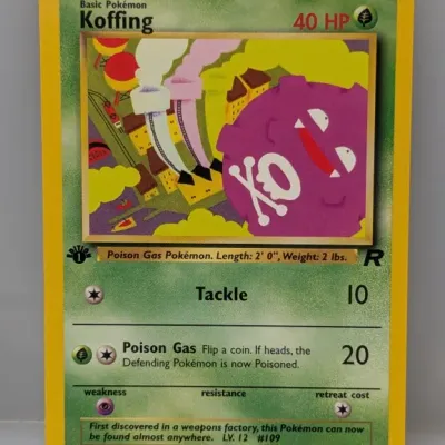 Sale Photo Thumbnail #427: 1st Edition Koffing Pokémon trading card #58/82 from the Team Rocket set, produced by Wizards of the Coast circa 2000.