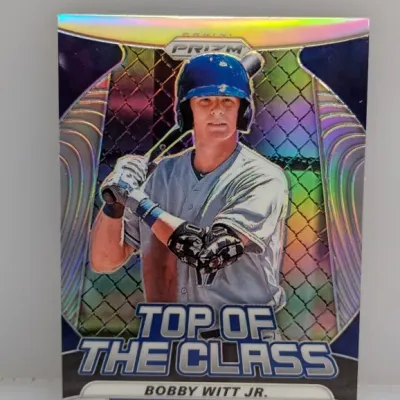 Sale Photo Thumbnail #29: Panini Prizm 'Top of the Class' Bobby Witt Jr. trading card featuring a metallic holographic finish.