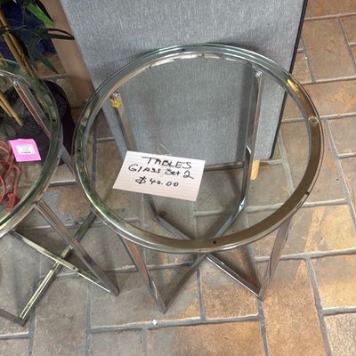 Sale Photo Thumbnail #20: Pair of modern round glass-top side tables with chrome-finished cross-base metal frames.