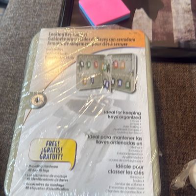 Sale Photo Thumbnail #13: Locking key cabinet, new in plastic packaging with included mounting hardware and key ID tags.