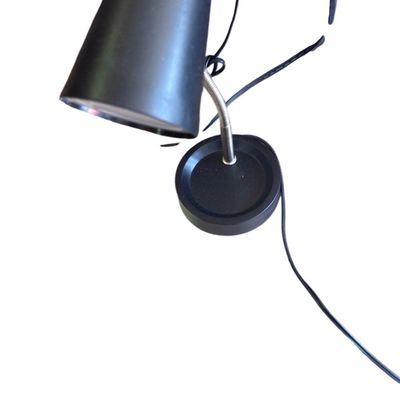 Sale Photo Thumbnail #29: Modern black desk lamp featuring a tapered cone shade and a flexible metal gooseneck arm.