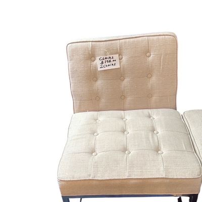 Sale Photo Thumbnail #47: Mid-century modern armless accent chair featuring beige tufted upholstery and dark metal legs.