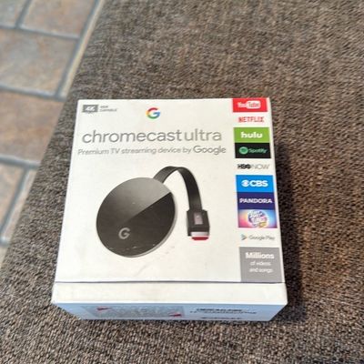 Sale Photo Thumbnail #18: Google Chromecast Ultra 4K TV streaming device in its original retail packaging.