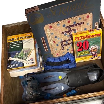 Sale Photo Thumbnail #12: A wooden box containing a vintage Scrabble game, educational software, a USB 2.0 PCI card in its box, and a set of snorkeling gear.
