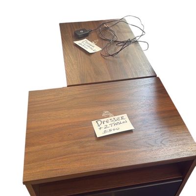 Sale Photo Thumbnail #51: Mid-century modern style walnut nightstands featuring a single drawer with brass hardware and an open storage cubby on tapered legs.