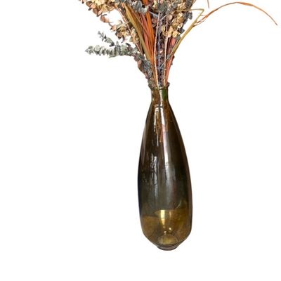 Sale Photo Thumbnail #46: Tall amber glass vase filled with an arrangement of dried flowers, grasses, and preserved eucalyptus.