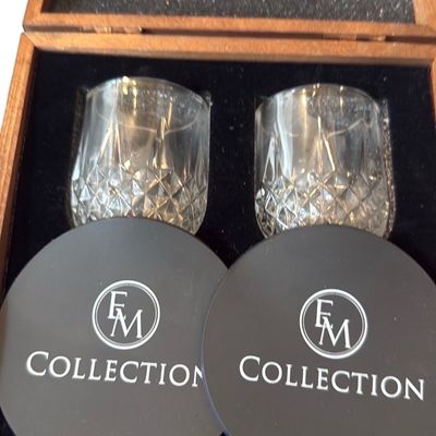 Sale Photo Thumbnail #45: FM Collection whiskey tasting gift set in a wooden display box, featuring cut crystal rocks glasses, slate coasters, and whiskey stones.