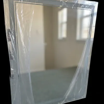 Sale Photo Thumbnail #373: Brand new modern rectangular wall mirror featuring integrated perimeter LED backlighting and frosted border band (sealed in original protective film).