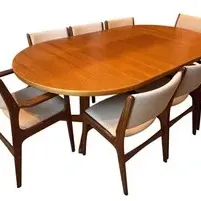 Sale Photo Thumbnail #32: Mid-Century ABJ of Denmark Table with 8 Chairs. Construction: Sculpted wood frames with upholstered seats and backs
Condition: Light vintage wear
Dimensions: 86" W x 47" D x 27" H
