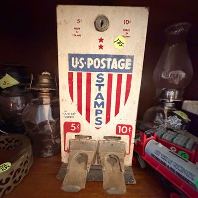 Sale Photo Thumbnail #95: Vintage mid-century US Postage stamp dispenser machine featuring red, white, and blue patriotic graphics and coin slots for 5-cent and 10-cent purchases.