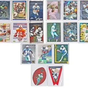 Assortment of 1990s NFL trading cards featuring players like Troy Aikman and Mark Brunell, housed in individual protective sleeves.