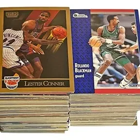 Two thick stacks of vintage 1990s NBA basketball trading cards featuring SkyBox Lester Conner and Fleer Rolando Blackman on top.