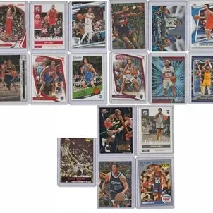 Collection of modern and vintage NBA trading cards, individually sleeved in protective top loaders.