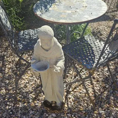 Metal And Stone Bistro Table And Monk Statue 