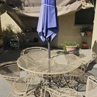 Metal Table, Four Matching Chairs And A Table Umbrella 