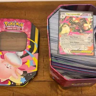 300 Holographic/Foil Pokemon Cards In Collectible Tins