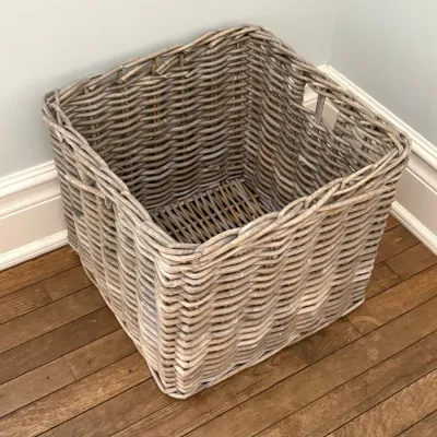 Sale Photo Thumbnail #154: Large square gray woven rattan storage basket with cutout handles.